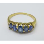 A yellow metal and sapphire ring, 2.