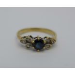 A yellow metal, sapphire and white stone ring, 1.