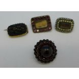 Four brooches; Bohemian garnet, two memorial and one carved jet,