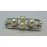 An 18ct white gold and platinum, pearl and diamond brooch, 7.5g, 3.