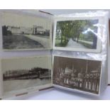 An album of approximately 200 Edwardian and later postcards