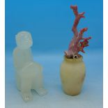 Coral mounted on a small alabaster vase and a carved model monkey