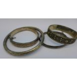 Three hallmarked silver bangles and one other,