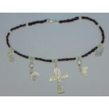 An Egyptian style garnet and mother of pearl bead necklace