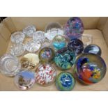 A collection of glass paperweights including Isle of Wight and Caithness and glass candle holders