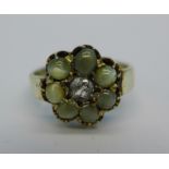 A 'cats eye' stone and diamond set cluster ring,