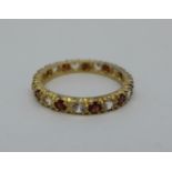 A 9ct gold and stone set eternity ring, 1.