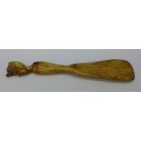 A shoehorn with carved Egyptian head,