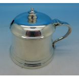 A silver mustard pot with blue glass liner, London 1949, Wakely & Wheeler,