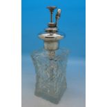 A silver mounted glass scent atomiser,