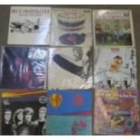 A collection of thirteen LP records including Blue Oyster Cult, Rolling Stones, Toy Dolls, etc.