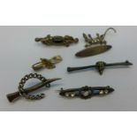 Seven brooches including Victorian silver horseshoe, marcasite set lizard, fox head, 'Baby', etc.