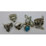 Six silver Gothic style rings including 925 silver