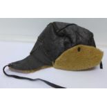 A sheepskin lined flying hat