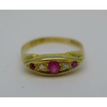 An 18ct gold, ruby and diamond ring, one ruby replaced, 3g,