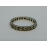 A white metal and diamond set eternity ring, 3.