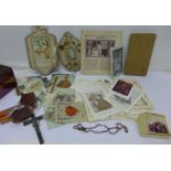 A box of religious artefacts and ephemera including bookmarks and rosary beads