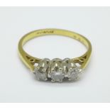 An 18ct gold and three stone diamond ring, 2.