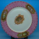 A pink and gilt hand decorated cabinet plate,