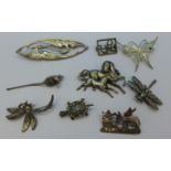 Nine brooches including silver