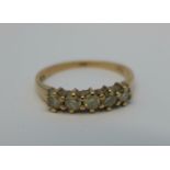 A 9ct gold and five stone diamond ring, 2g,