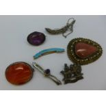 A silver Charles Horner brooch set with a pink stone,