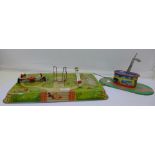 Two tin-plate toys, playground made in Western Germany and coach station,