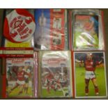 A quantity of Nottingham Forest football programmes, a signed print of Stuart Pearce,