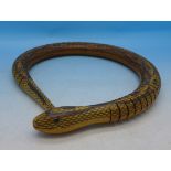 An articulated wooden toy snake