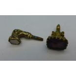 A gilt metal watch key and seal fob