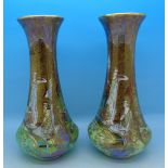 A pair of Wilton Ware lustre vases, decorated with two ladies,