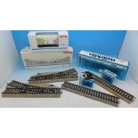 A Marklin HO gauge rail wagon, seven pieces of track, two manual turnouts and two buffers,