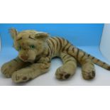 An early 20th Century soft toy tiger,