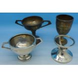 Three small silver trophies and a silver golf ball (hole-in-one) holder,
