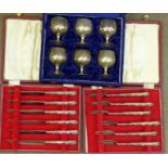 A cased set of six silver handled butter knives and six pastry forks,