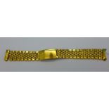 A gold plated Omega bracelet strap