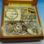 A wooden jewellery box and costume jewellery, total weight 1.