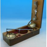 A cased set of balance scales, made in Germany,