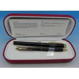 A Sheaffer pencil and pen set with 14k gold nib,