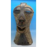 African tribal souvenir; a Songye Kifwebe mask,