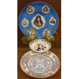 A pair of glass baskets, a charger with portraits, marked Dufour Grand Dauphin,