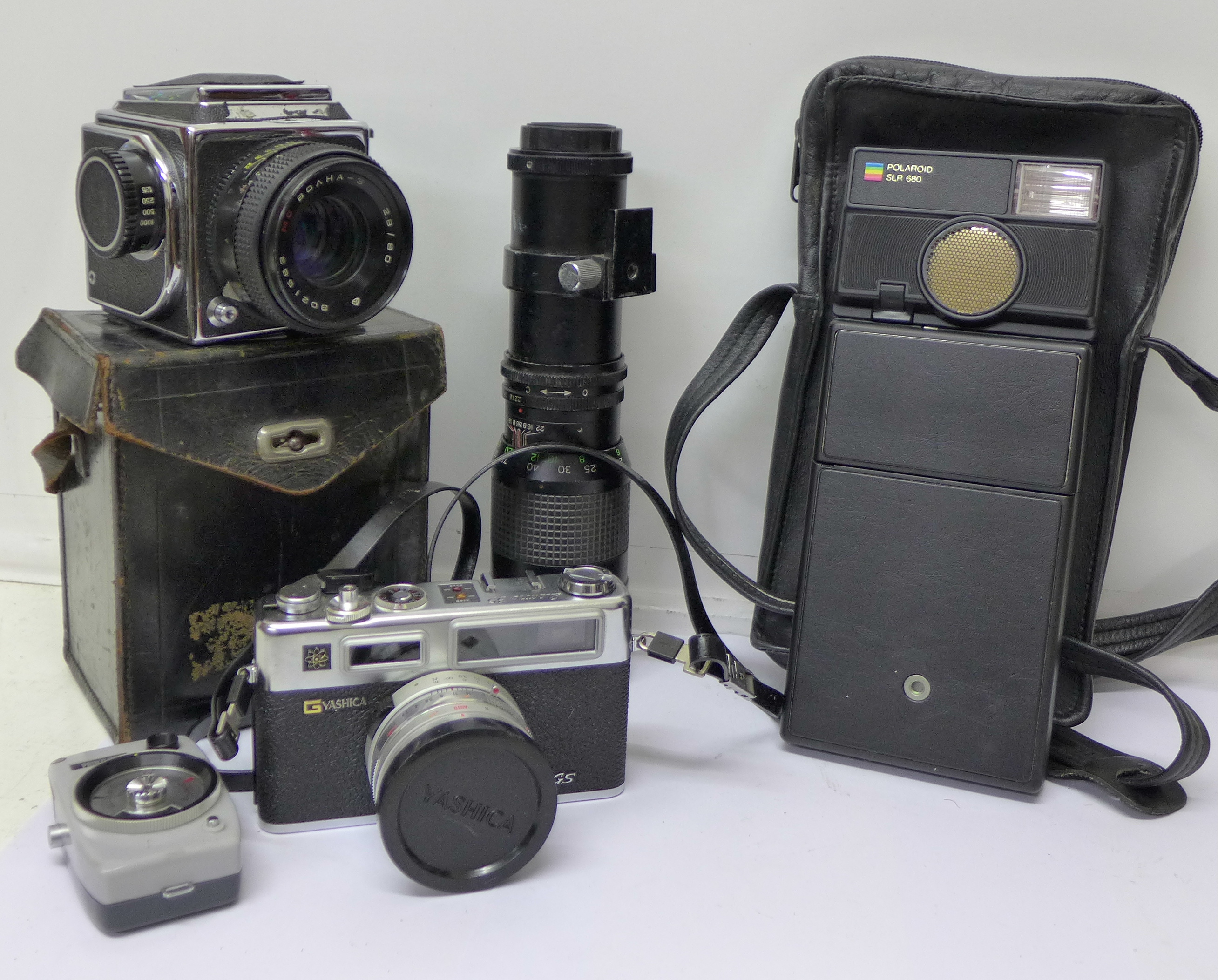 A Russian Kev 120 medium format camera, a Yashica Electro 35 Range finder camera,