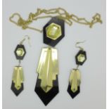 An Art Deco style lucite pendant and earrings