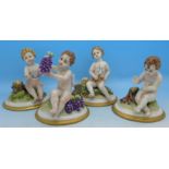 A set of four Neapolitan Four Seasons cherub figures,