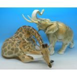 A Royal Dux model of an elephant and a Russian model of a giraffe,