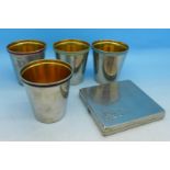 A set of four gilded hunting cups and a compact marked Valentine