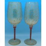 A pair of Venetian wine glasses with gilded decoration,