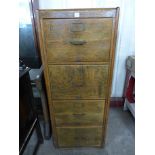 An early 20th Century oak four drawer filing cabinet