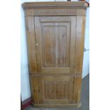 A George III pine freestanding corner cupboard