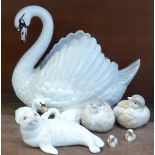 A large Dartmouth pottery swan, two Beswick swans and two cygnets,